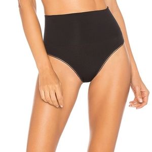 Yummie Seamlessly Shaped Ultralight Nylon Thong in Black